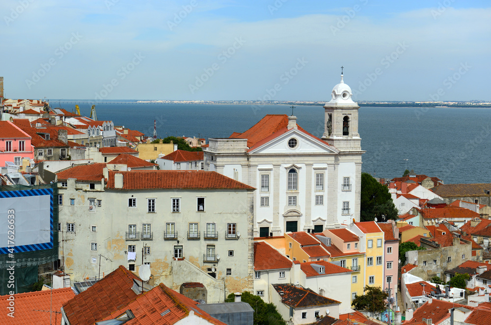 Igreja de Santo Estevao in Alfama district at the east of Lisbon with Tagus River at the background, Lisbon, Portugal.