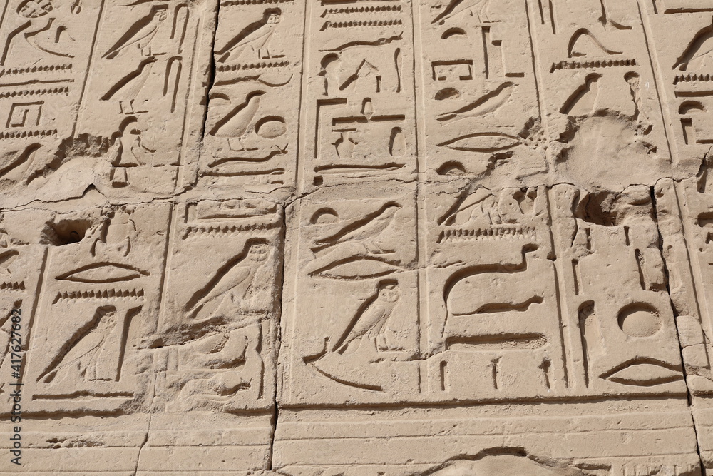 Fototapeta premium Karnak temple in historic city. Ruins of the ancient town. View of the antique famous sculptures at the Karnak Temple in Luxor, Egypt. Travel to African continent. UNESCO World Heritage Site.