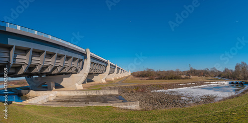 Panoramic view over a famous wonder water bridge and ship navigation canal near Magdeburg at early Spring, Magdeburg, Germany. photo