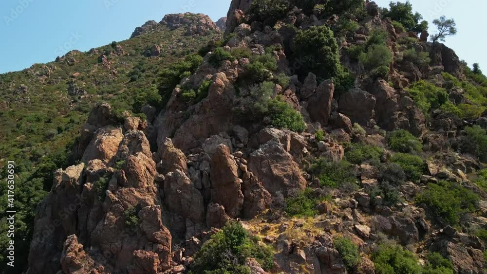 Drone Flying Near Rocky Mountain With Green Vegetation On A Sunny Day Of Summer In Sardinia, Italy - Aerial drone close up shot Drone Flying Near Rocky Mountain With Green Vegetation On A Sunny Day Of Summer In Sardinia, Italy - Aerial drone close up shot