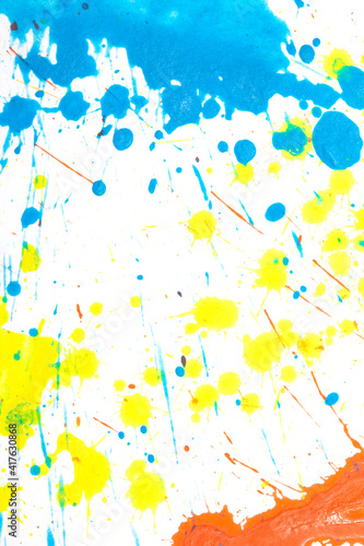 Orange, Blue and Yellow Acrylic Paint Splatters and Lines on White Bckground