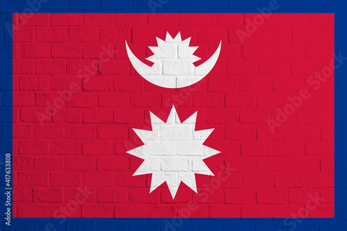 Flag of Nepal. Brick wall texture of the flag of Nepal photo