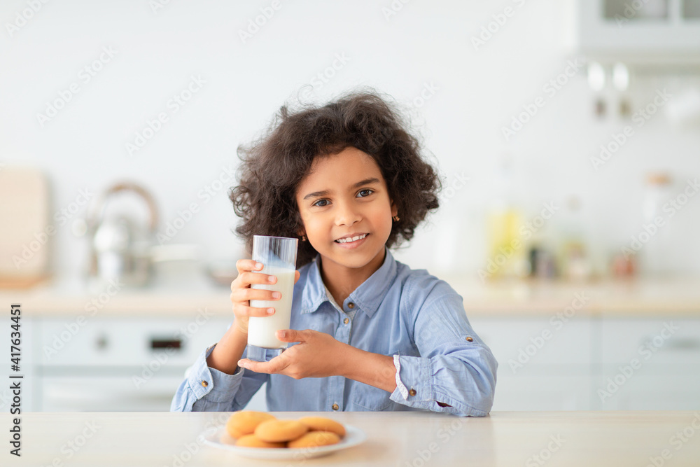 Cute Little Afro Girl Drinking Milk From Glass