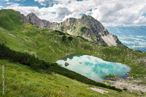 Alpine landscape with a mountain lake