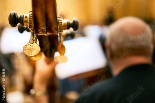 Close-up of a double bass head with tuning keys. Rehearsal Symphony orchestra.