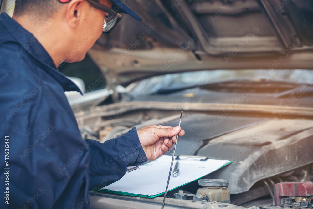 Mechanic car service auto garage in automotive mobile center. Technician workshop repair engine motor vehicles service mechanical engineering business. Automobile mechanic hands car repairs technic Mechanic car service auto garage in automotive mobile center. Technician workshop repair engine motor vehicles service mechanical engineering business. Automobile mechanic hands car repairs technic