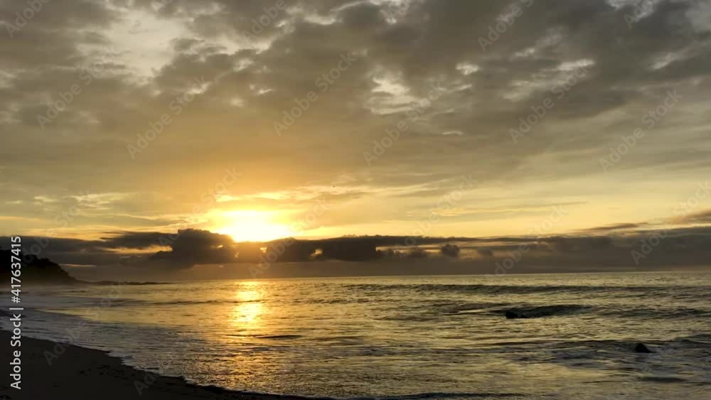 Ocean waves hitting the beach in a morning sunrise in Cosa Rica Ocean waves hitting the beach in a morning sunrise in Cosa Rica