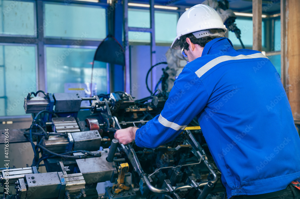 worker with robot in factory worker with robot in factory