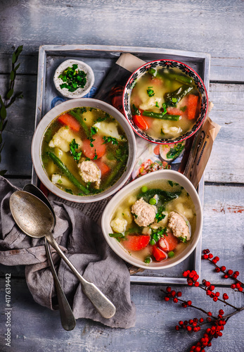 vegetable soup with meatballs and dumplings.style rustic photo