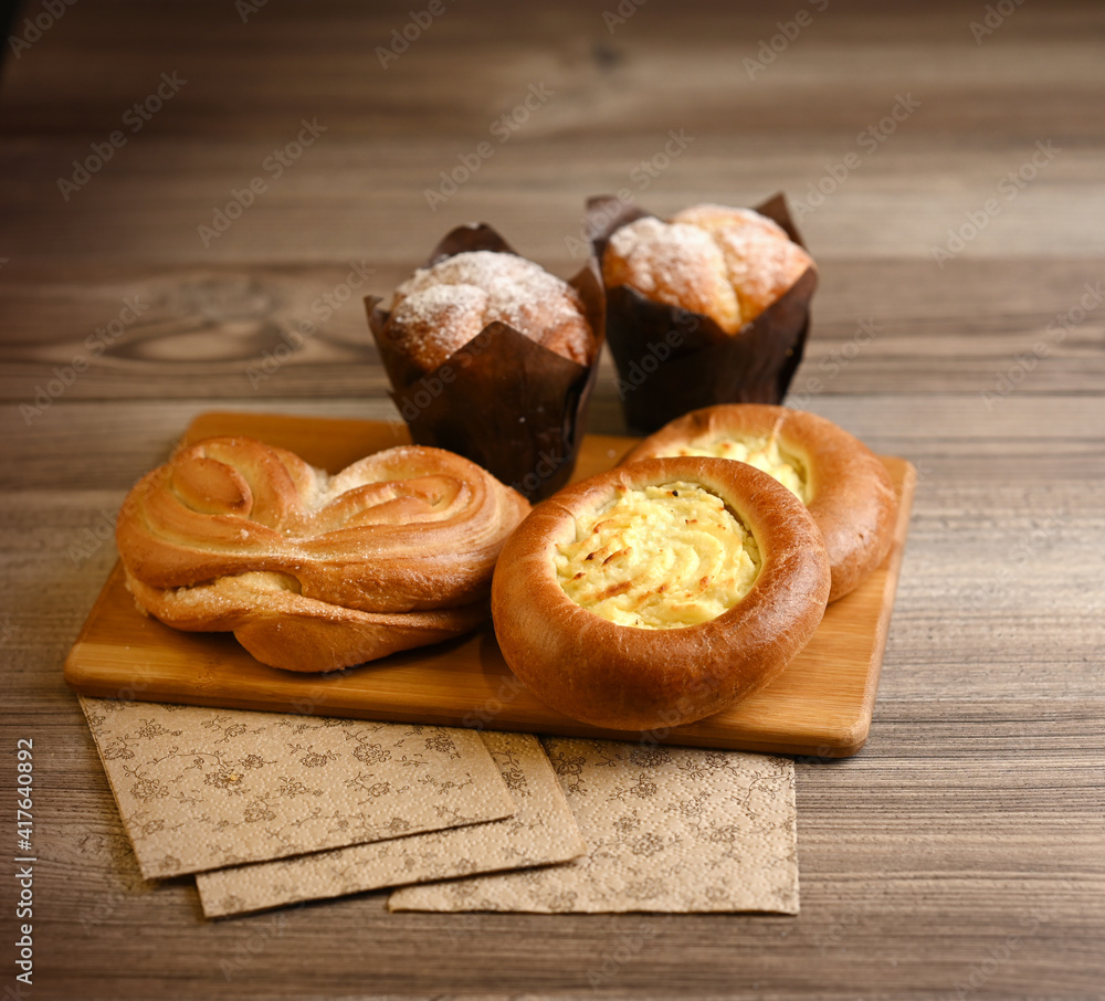 Sweet pastries on a cutting board. Image with selective focus.