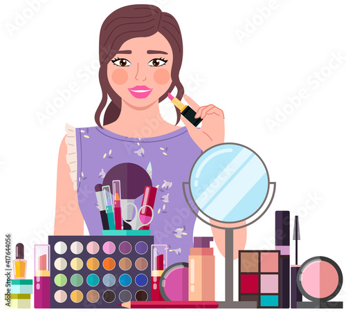 Beautiful young girl makes look and does makeup, looks after beauty and paints lips isolated on white. Makeup cosmetics tools and Korean cosmetics. Beauty products collection for skin care and health photo