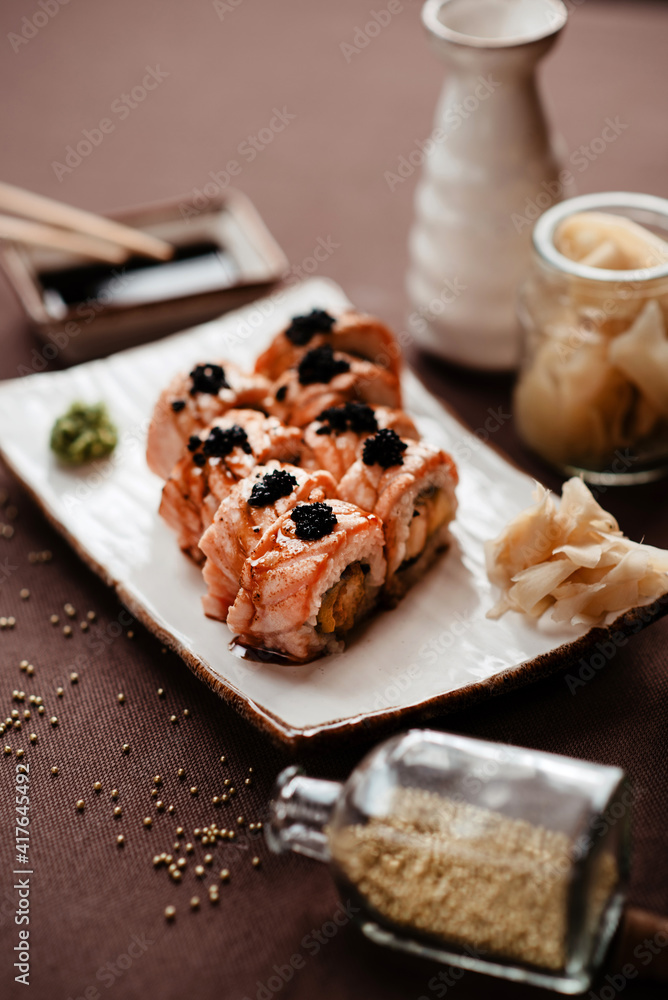 Sushi rolls with salmon and black caviar