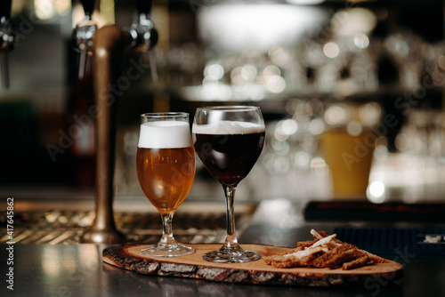 Light and dark beer in glasses on the bar