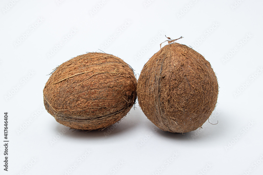 Isolated coconut on a white background. Two coconuts in the center of the image. Healthy food Isolated coconut on a white background. Two coconuts in the center of the image. Healthy food