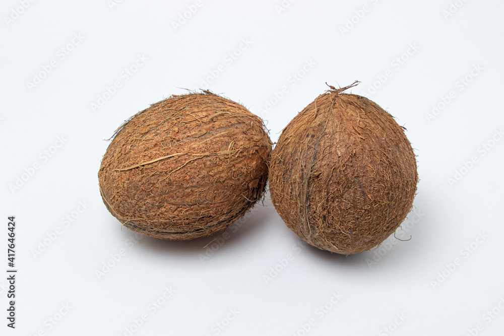 Isolated coconut on a white background. Two coconuts in the center of the image. Healthy food Isolated coconut on a white background. Two coconuts in the center of the image. Healthy food