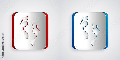 Paper cut Human footprint icon isolated on grey background. Trace of human foot. Paper art style. Vector.