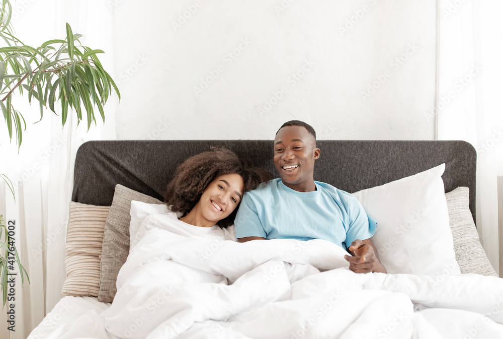 Fototapeta premium Weekend in bed, waking, good morning in comfortable interior at new home after repair