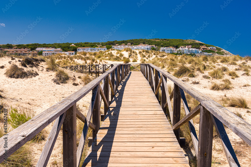 A hiking trail path among dunes near Cala Mesquida on Mallorca island in Mediterranean Sea