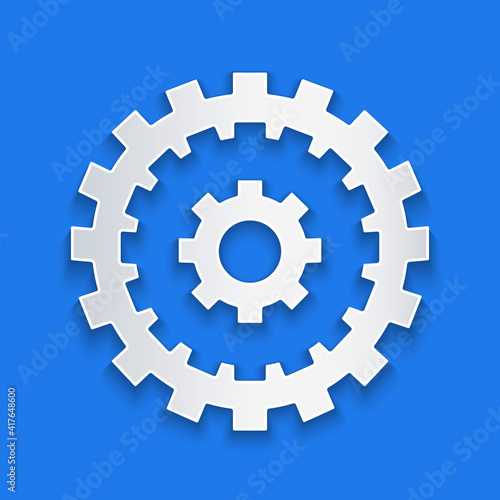 Paper cut Bicycle cassette mountain bike icon isolated on blue background. Rear Bicycle Sprocket. Chainring crankset with chain. Paper art style. Vector.