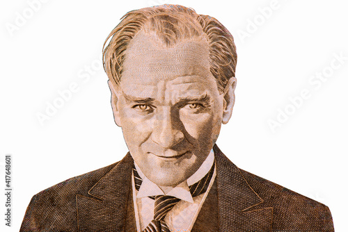 Mustafa Kemal Ataturk - first president of Turkey. Portrait photography made with old turkish banknote and isolated on white on the ground. photo
