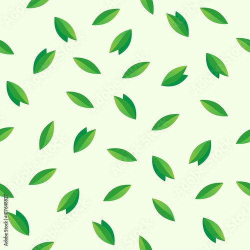 Vector seamless pattern of green leaves randomly arranged on a gentle light green background. Background from leaves.