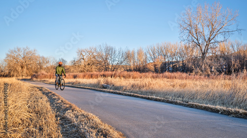 Winter or fall commuting on a bike trail - Poudre River Trail in northern Colorado
