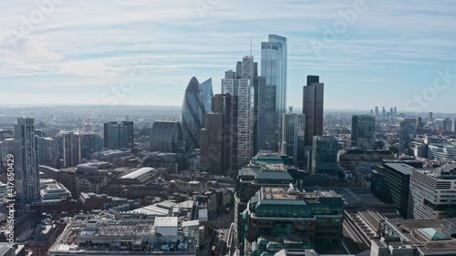 Long aerial dolly back London drone shot of skyscrapers photo