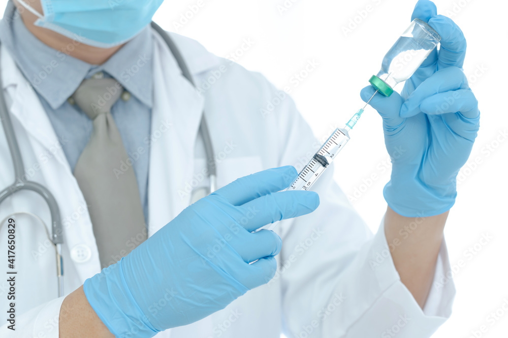 vaccines fight against virus covid-19 corona virus, doctor or scientist in laboratory holding a syringe with liquid vaccines. vaccines fight against virus covid-19 corona virus, doctor or scientist in laboratory holding a syringe with liquid vaccines.