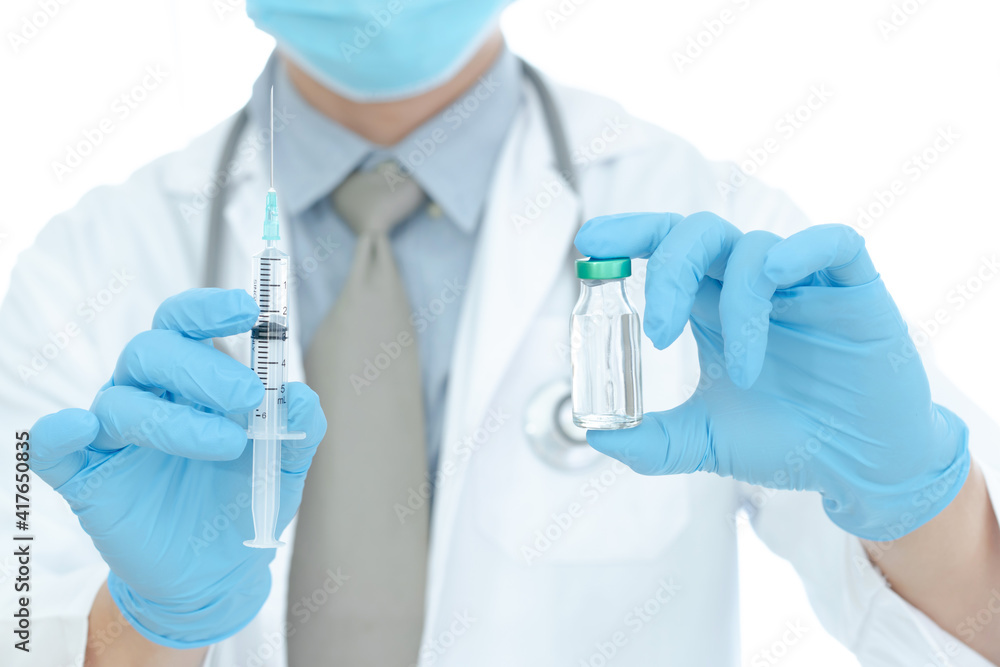 vaccines fight against virus, doctor or scientist in laboratory holding a syringe with liquid vaccines. vaccines fight against virus, doctor or scientist in laboratory holding a syringe with liquid vaccines.