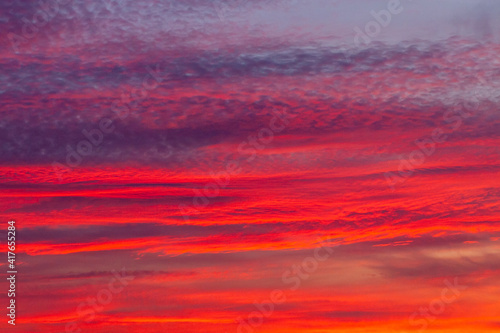 Beautiful sunset sky with clouds. © Ilmar
