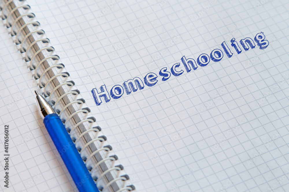 Text Homeschooling handwritten on sheet of notebook Text Homeschooling handwritten on sheet of notebook