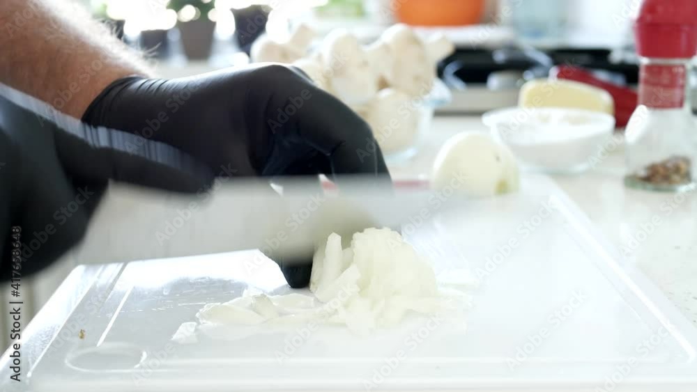 Spicy White Onion Chopped with a Knife in the Kitchen Spicy White Onion Chopped with a Knife in the Kitchen