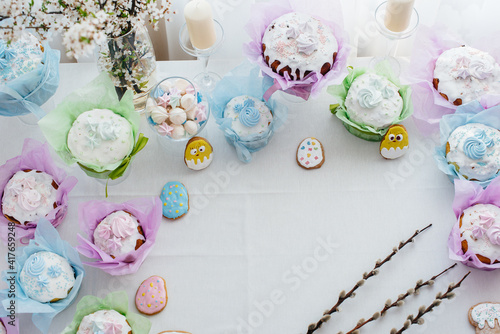 Beautiful Easter cakes on a decorated light table. A light holiday of Easter.