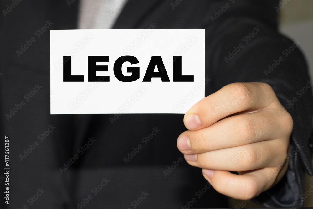 Card with text LEGAL on hand. You can use in business, marketing and other concepts. Messege of the day Card with text LEGAL on hand. You can use in business, marketing and other concepts. Messege of the day