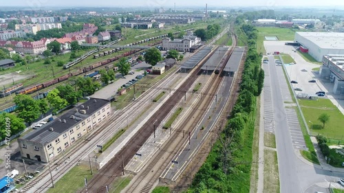 The passenger train departs from the railway station in the city of Oleśnica in the Lower Silesian Voivodeship in Poland.