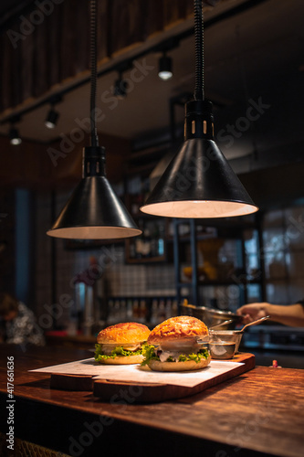 Two mouth-watering, delicious homemade burger on a wooden table