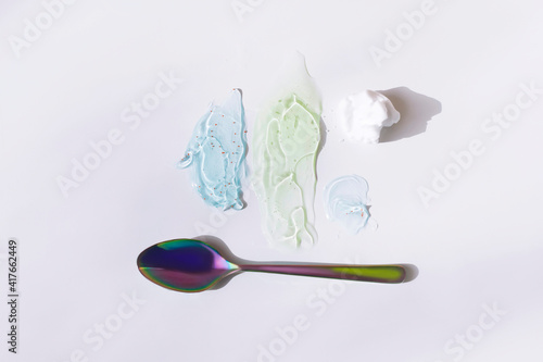 Facial care products smeared on a white background, kram, shaving foam, scrub. Men's body and face care products.Everything for skin, cream and gel