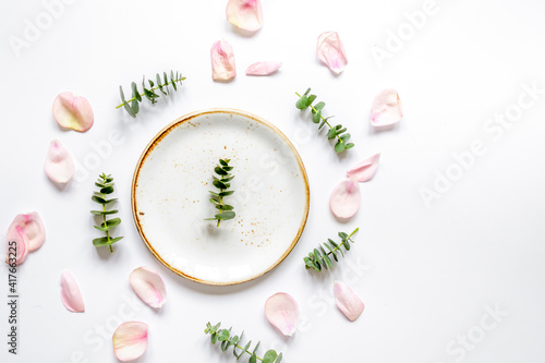 Spring trandy design with plate and blossom white background top view mockup