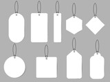 Blank white paper price tags or gift tags in different shapes. Set of labels with cord.