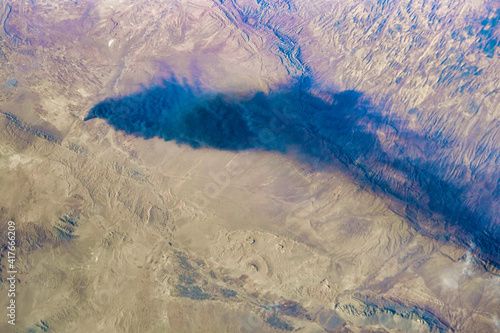 Fototapeta Naklejka Na Ścianę i Meble -  A fire with dark smoke over Afghanistan. Digital Enhancement. Elements of this image furnished by NASA