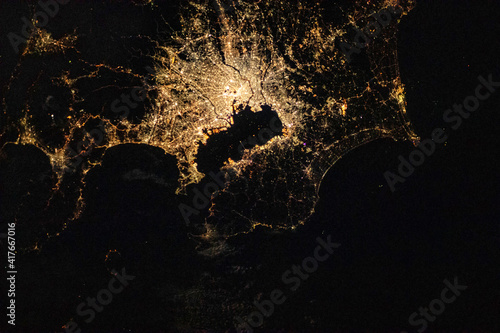 Fototapeta Naklejka Na Ścianę i Meble -  Satellite view of Tokyo at night. Digital Enhancement. Elements of this image furnished by NASA