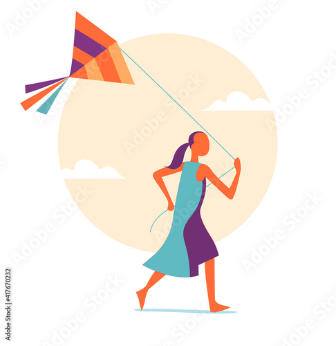 Ragazza che corre con un aquilone che vola nell'aria