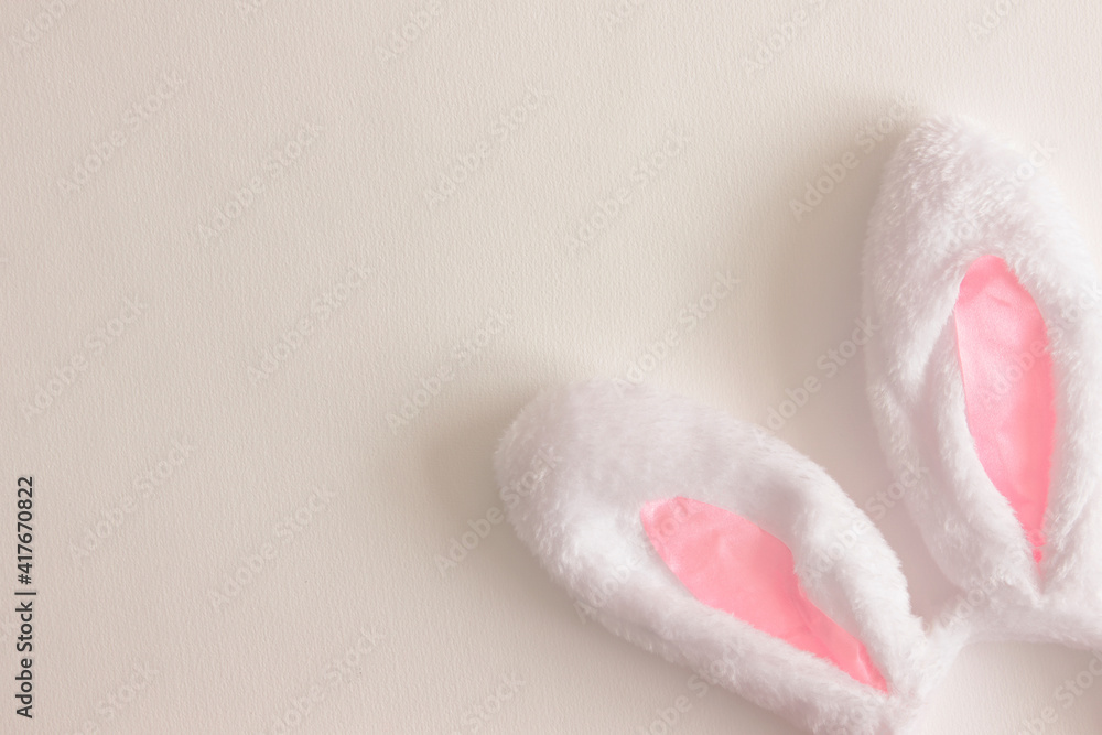 White bunny ears on a white background. Copy space. Easter background White bunny ears on a white background. Copy space. Easter background