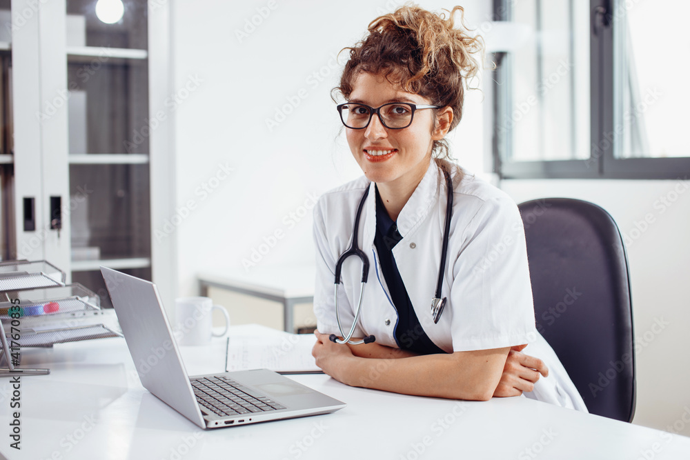 Young female doctor at doctor’s office. Portrait of female doctor. Young female doctor at doctor’s office. Portrait of female doctor.