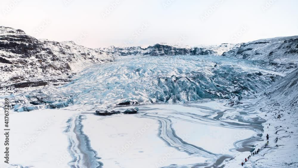 Beautiful blue ice glacier in Iceland covered with snow aerial view on a sunny winter day in Iceland Beautiful blue ice glacier in Iceland covered with snow aerial view on a sunny winter day in Iceland