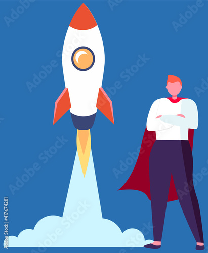 Super Hero businessman standing in red cloak near the rocket ready to take off on blue background. Successful super business man near flying space ship. Concept of inspiration, business start up © robu_s