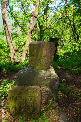 An old khachkar  cross-stone  situated in the forest  Armenia