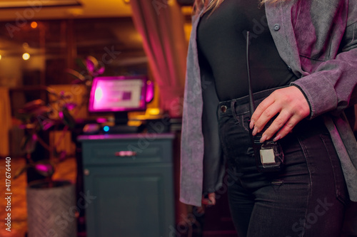 Foto Close-up of female with Walkie talkie keeps on jeans.