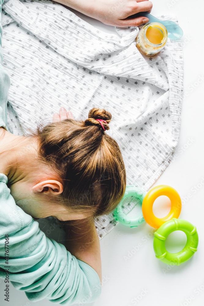 Naklejka premium lifestyle tired mother top view on white background