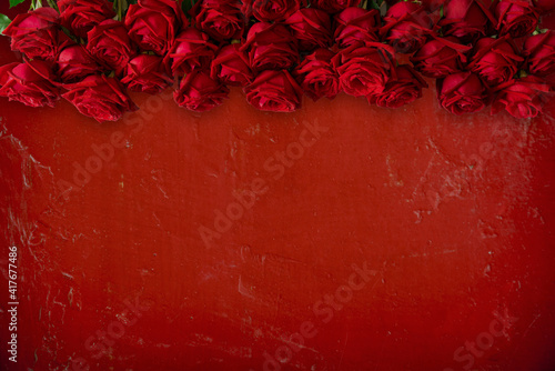 Antique red wall and roses texture background